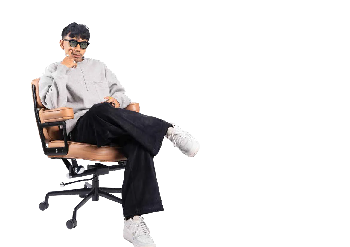 Yudha Bhaskara seated in a studio chair